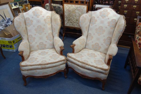 A PAIR OF WING BACK ARM CHAIRS