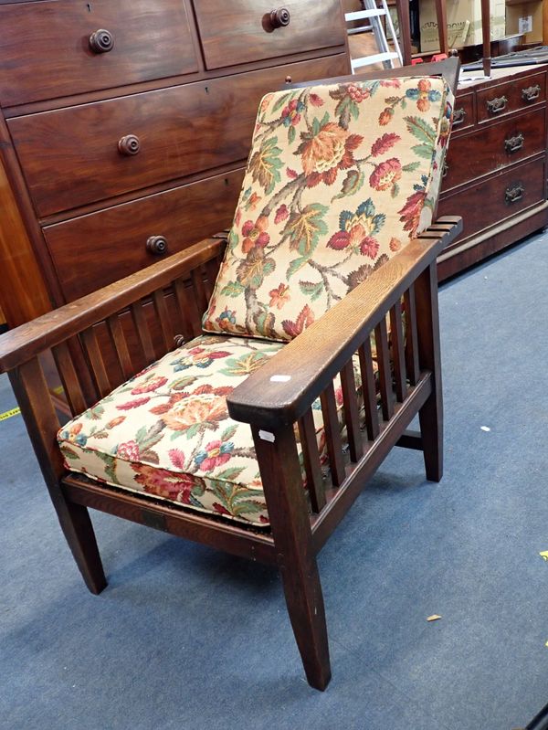 AN ARTS AND CRAFTS STYLE ADJUSTABLE ARMCHAIR WITH BRASS PLAQUE