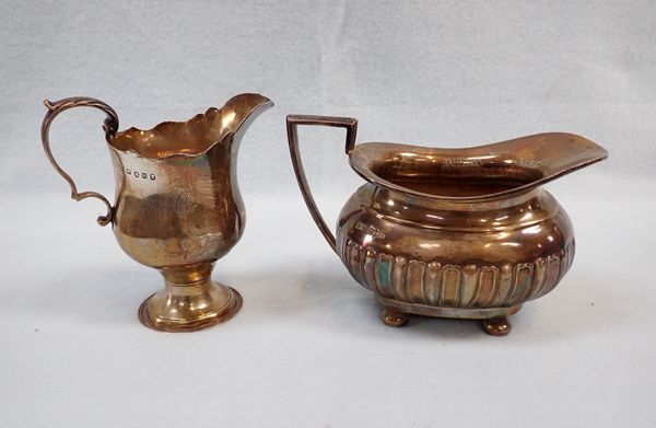 A  WALKER & HALL SILVER MILK JUG, AND A (DAMAGED) GEORGE III SILVER CREAM JUG