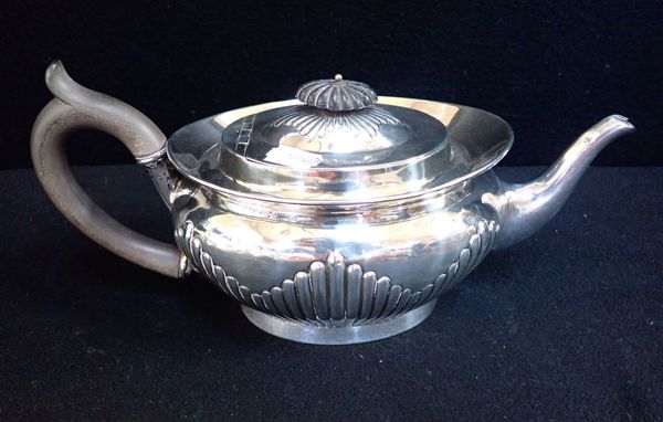 A SILVER TEAPOT