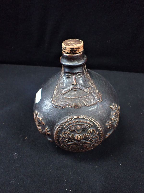 A 19TH CENTURY GERMAN "BELLARMINE" STYLE  JUG