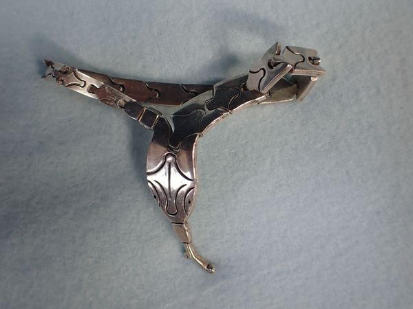A MEXICAN SILVER BRACELET, IN THE FORM OF AN ARTICULATED SNAKE