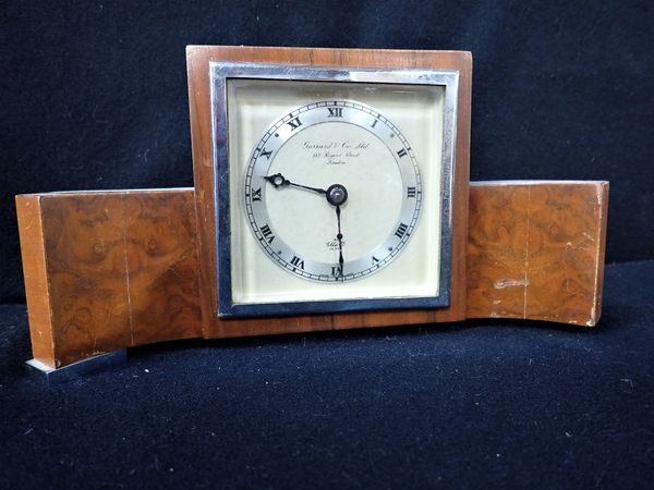 A 1950S 'ELLIOTT' CLOCK RETAILED BY GARRARD & CO