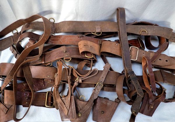 A COLLECTION OF VINTAGE MILITARY LEATHER BELTS