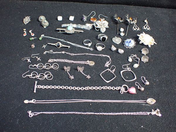 A PAIR OF HALLMARKED SILVER SCOTTISH  'STAG' PINS, SET WITH STONES,