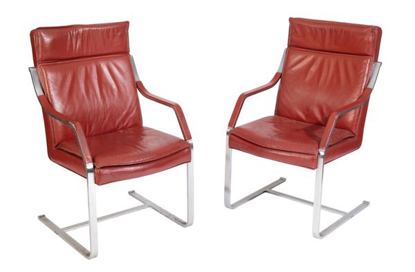 A SET OF FOUR CHROME AND RED LEATHER CANTILEVER ELBOW CHAIRS