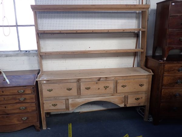 A GEORGE III STRIPPED PINE KITCHEN DRESSER