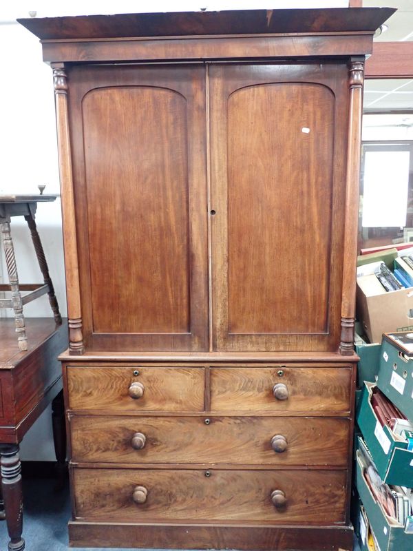 AN EARLY VICTORIAN MAHOGANY LINEN PRESS