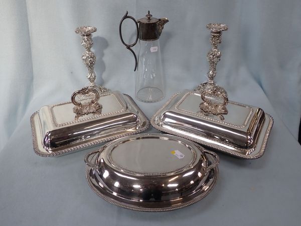 A PAIR OF SILVER-PLATED SERVING DISHES WITH COVERS