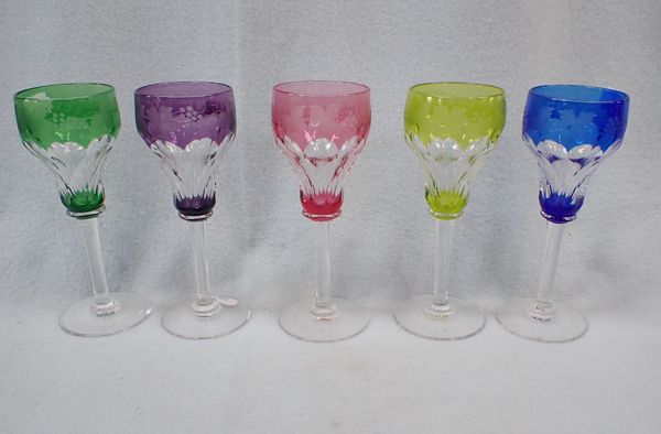 FIVE COLOURED, FACETED, AND ENGRAVED WINE GLASSES