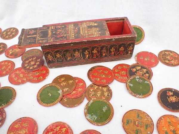 A BOX OF PERSIAN PAINTED COUNTERS