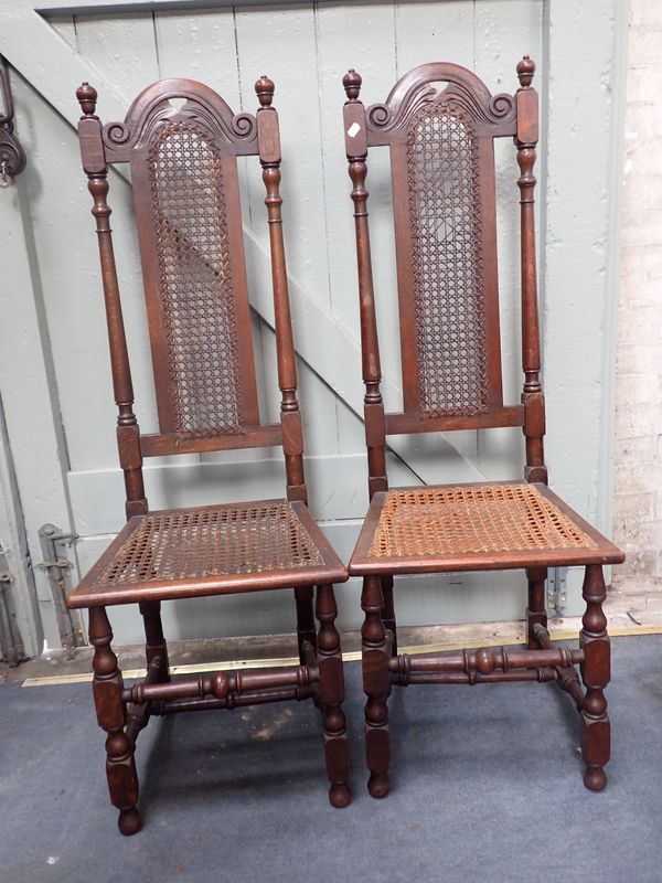 A PAIR OF CAROLEAN STYLE OAK HALL CHAIRS