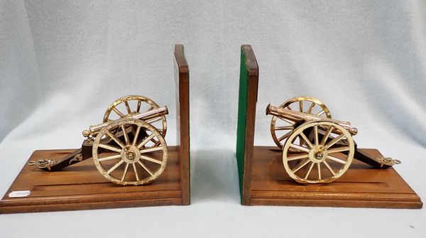 A PAIR OF MODEL CANNON, ON STANDS AS BOOKENDS