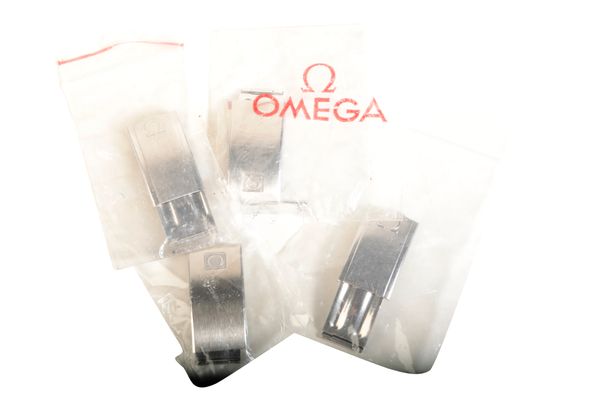 FOUR VARIOUS OMEGA WATCH CLASPS