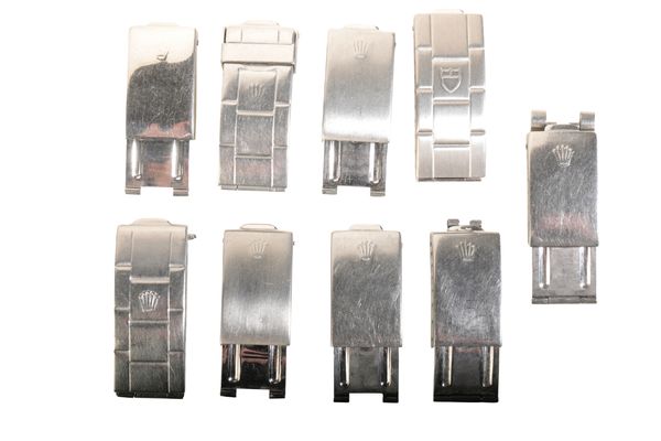 EIGHT VARIOUS ROLEX STAINLESS STEEL BRACELET CLASPS