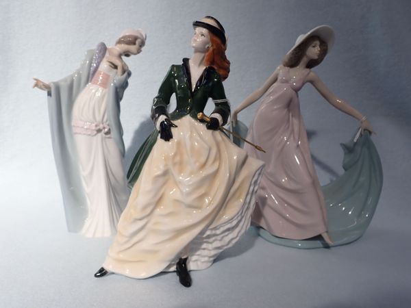 A ROYAL WORCESTER 'HIGH SOCIETY' FIGURINE