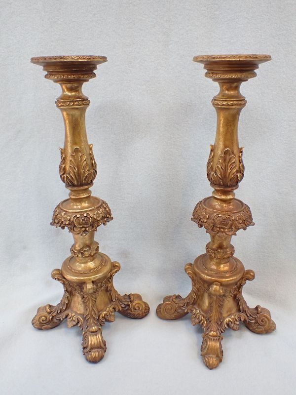 A PAIR OF REPRODUCTION ALTAR STYLE GILT CANDLESTICKS