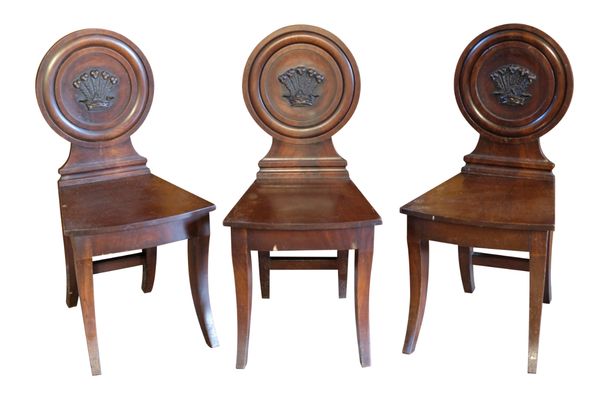 A SET OF SIX GEORGE III MAHOGANY HALL CHAIRS, CIRCA 1790