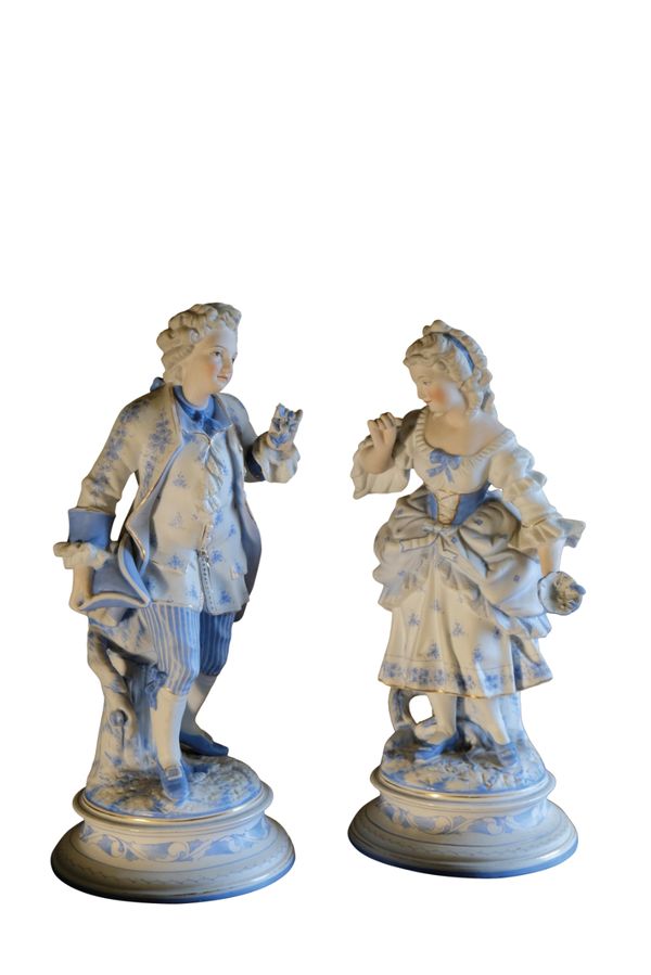 A PAIR OF CONTINENTAL BISQUE PORCELAIN CABINET FIGURES