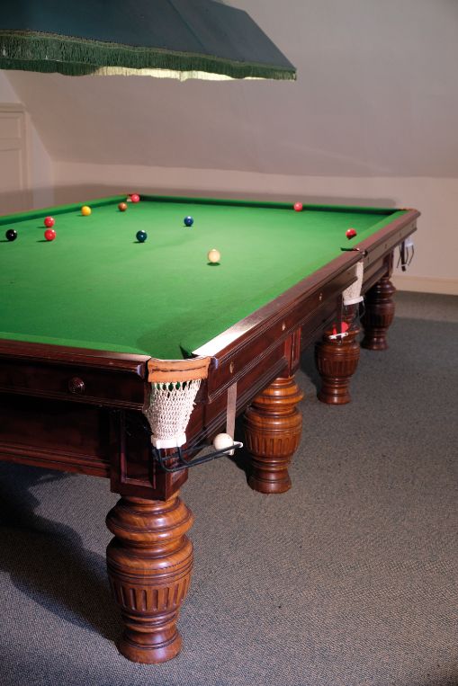 A BURROUGHES & WATTS FULL SIZE MAHOGANY BILLIARD TABLE