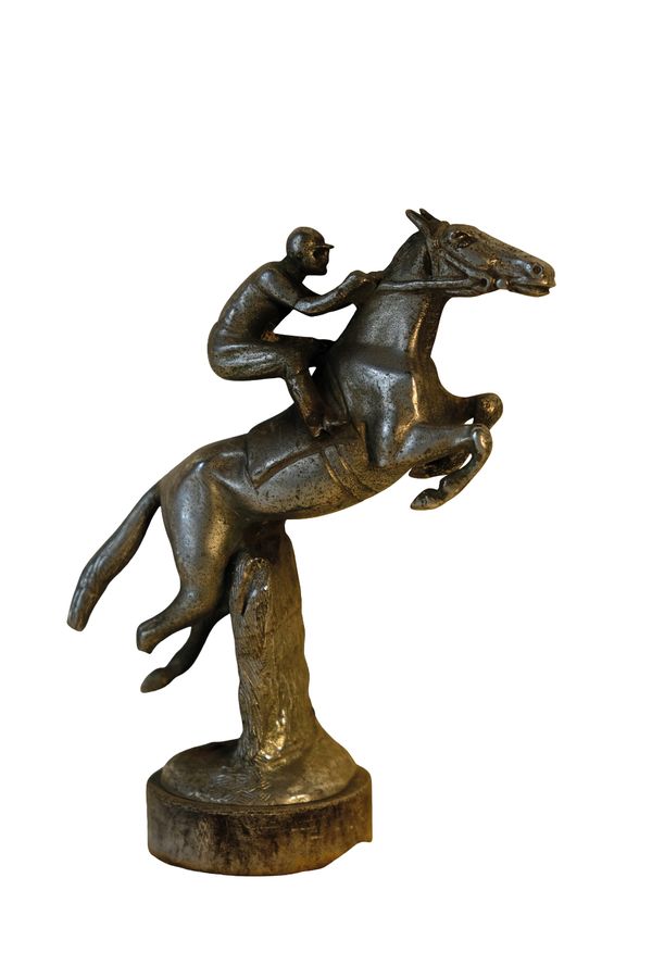 A WHITE METAL "HORSE AND JOCKEY" CAR MASCOT,