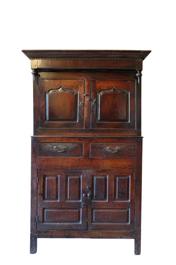 A CHARLES II OAK PRESS CUPBOARD