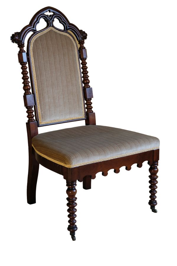 A VICTORIAN MAHOGANY GOTHIC REVIVAL DRESSING CHAIR