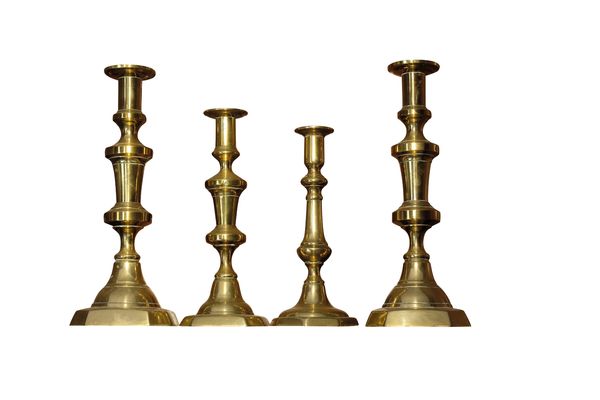 A PAIR OF VICTORIAN BRASS BALUSTER CANDLESTICKS