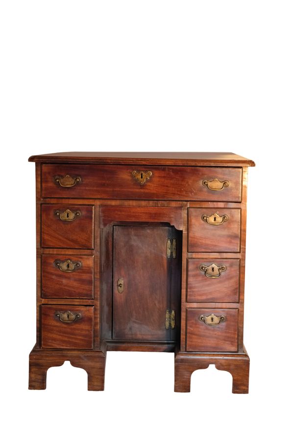 A GEORGE III SMALL MAHOGANY KNEEHOLE DESK