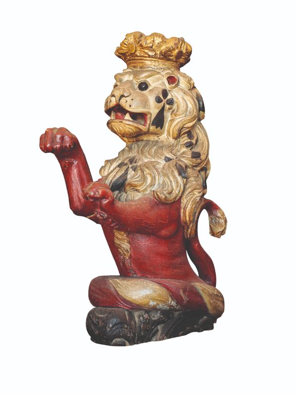 A CARVED GILTWOOD AND POLYCHROME HERALDIC LION