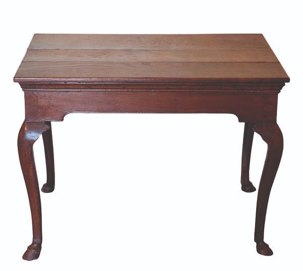 A GEORGE II IRISH PROVINCIAL OAK TABLE,