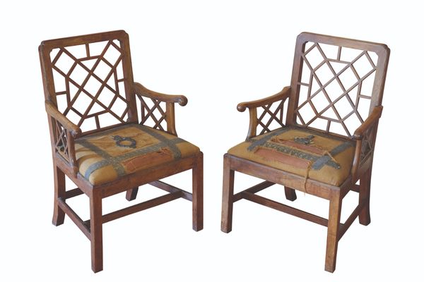 A PAIR OF GEORGE III "COCK PEN" ELBOW CHAIRS