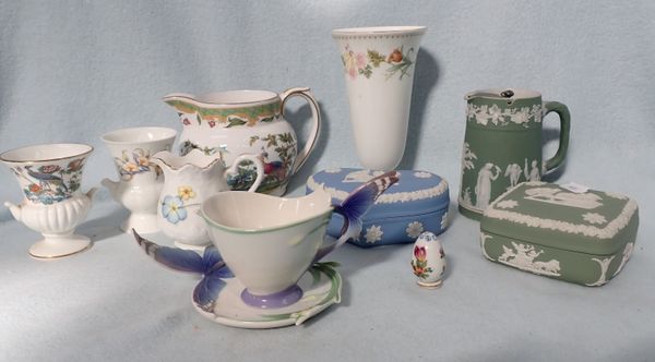 A FRANZ BUTTERFLY CUP AND SAUCER