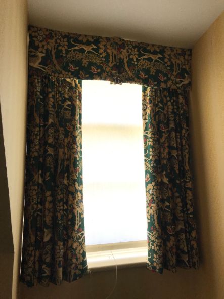 A SET OF CURTAINS IN TEAL WITH FLORAL PRINT,