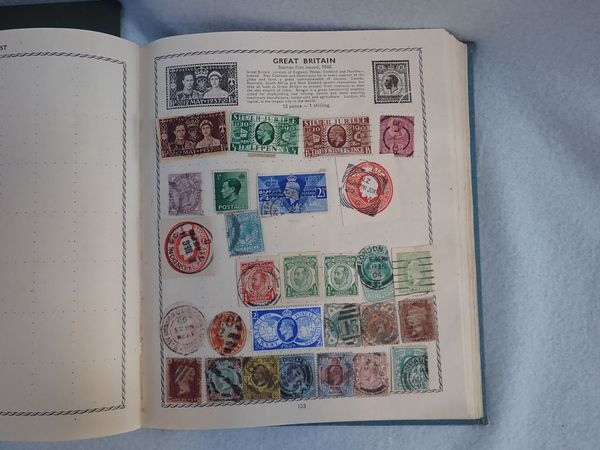 A VINTAGE 'TRIUMPH' STAMP ALBUM