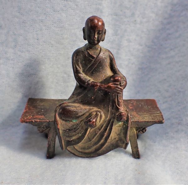 A BRONZE SEATED BUDDAH