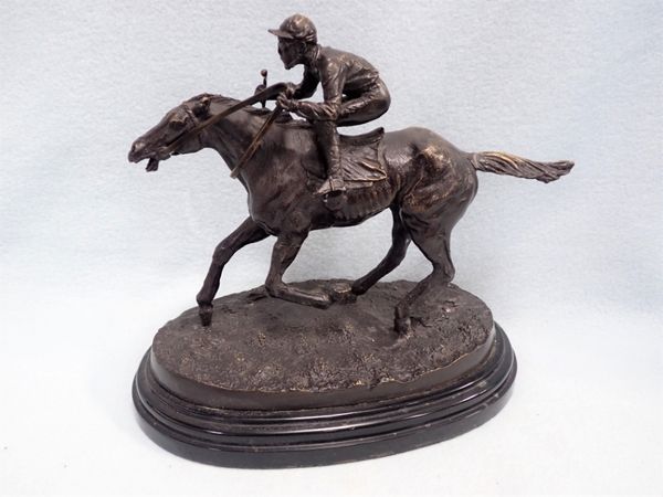 A BRONZE STUDY OF A RACEHORSE