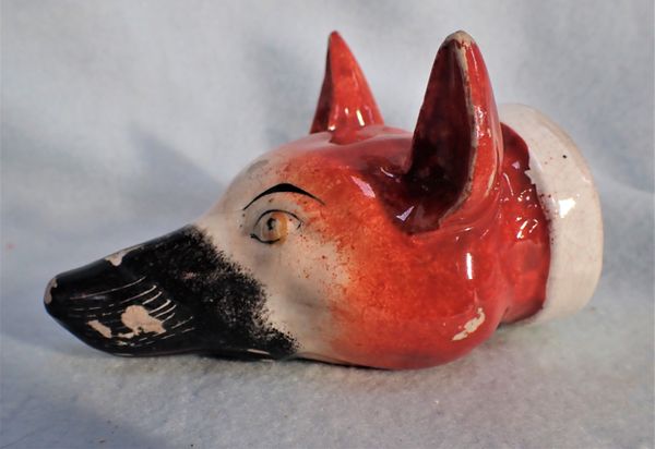 A STAFFORDSHIRE POTTERY FOX HEAD STIRRUP CUP