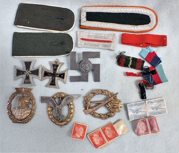 A COLLECTION OF NAZI STYLE BADGES