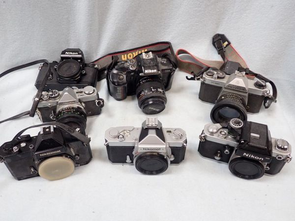 A COLLECTION OF  CAMERAS, INCLUDING NIKON