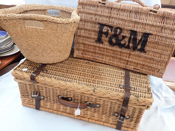 A PICNIC HAMPER, WITH LEATHER STRAPS