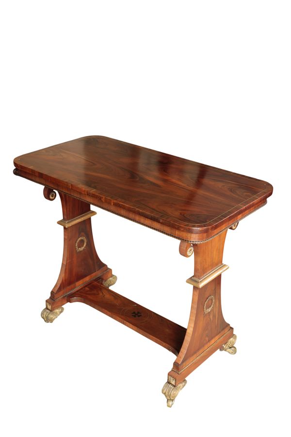 A GEORGE IV ROSEWOOD AND PARCEL GILT SIDE TABLE, IN THE MANNER OF MOREL & SEDDON,