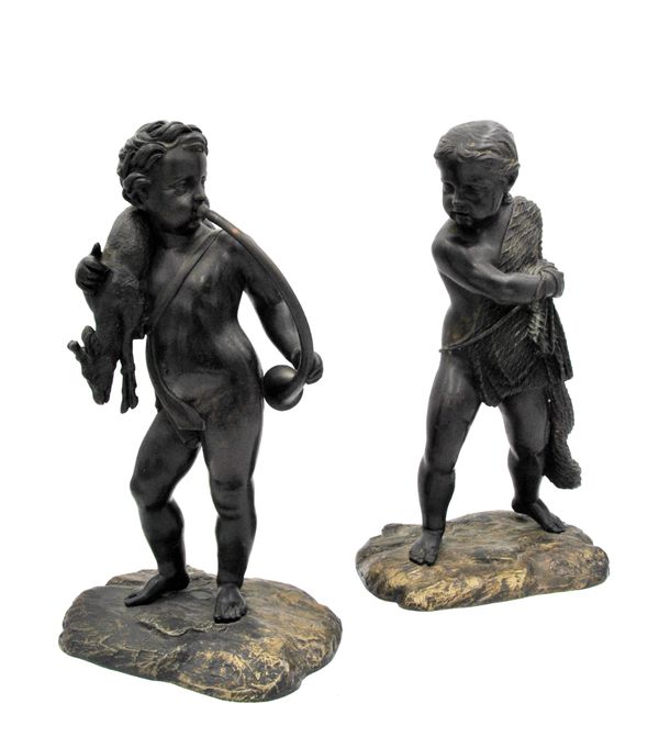 A PAIR OF CONTINENTAL PATINATED BRONZE MODELS OF PUTTI,