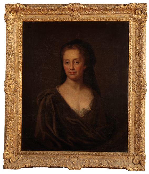 CIRCLE OF SIR GODFREY KNELLER (1646-1723) A portrait of a lady wearing a brown cloak and dark mantle