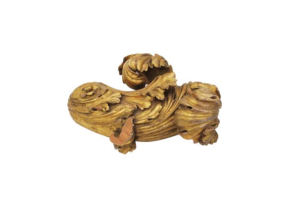 A FOLIATE CARVED AND GILT PINE CURTAIN POLE FINIAL, PROBABLY BY GILLOWS,