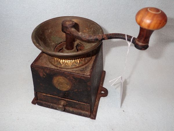 A VICTORIAN CAST IRON AND BRASS COFFEE GRINDER