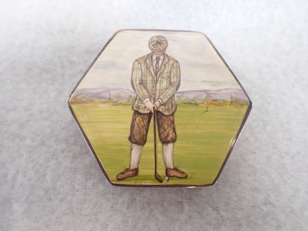 AN ENAMELLED SILVER PILL BOX DECORATED WITH A GOLFER