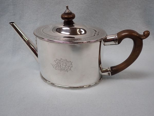 A SILVER TEA POT