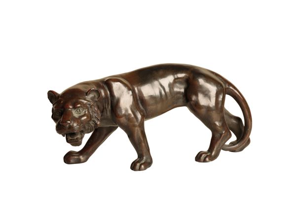 AN ORIENTAL PATINATED METAL MODEL OF A TIGER,