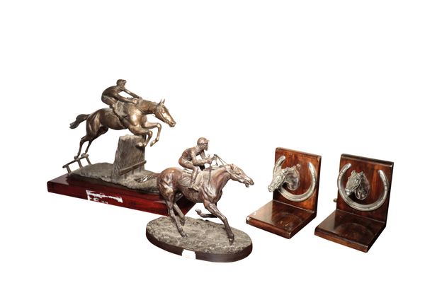 A PATINATED METAL GROUP OF A RACEHORSE AND JOCKEY,